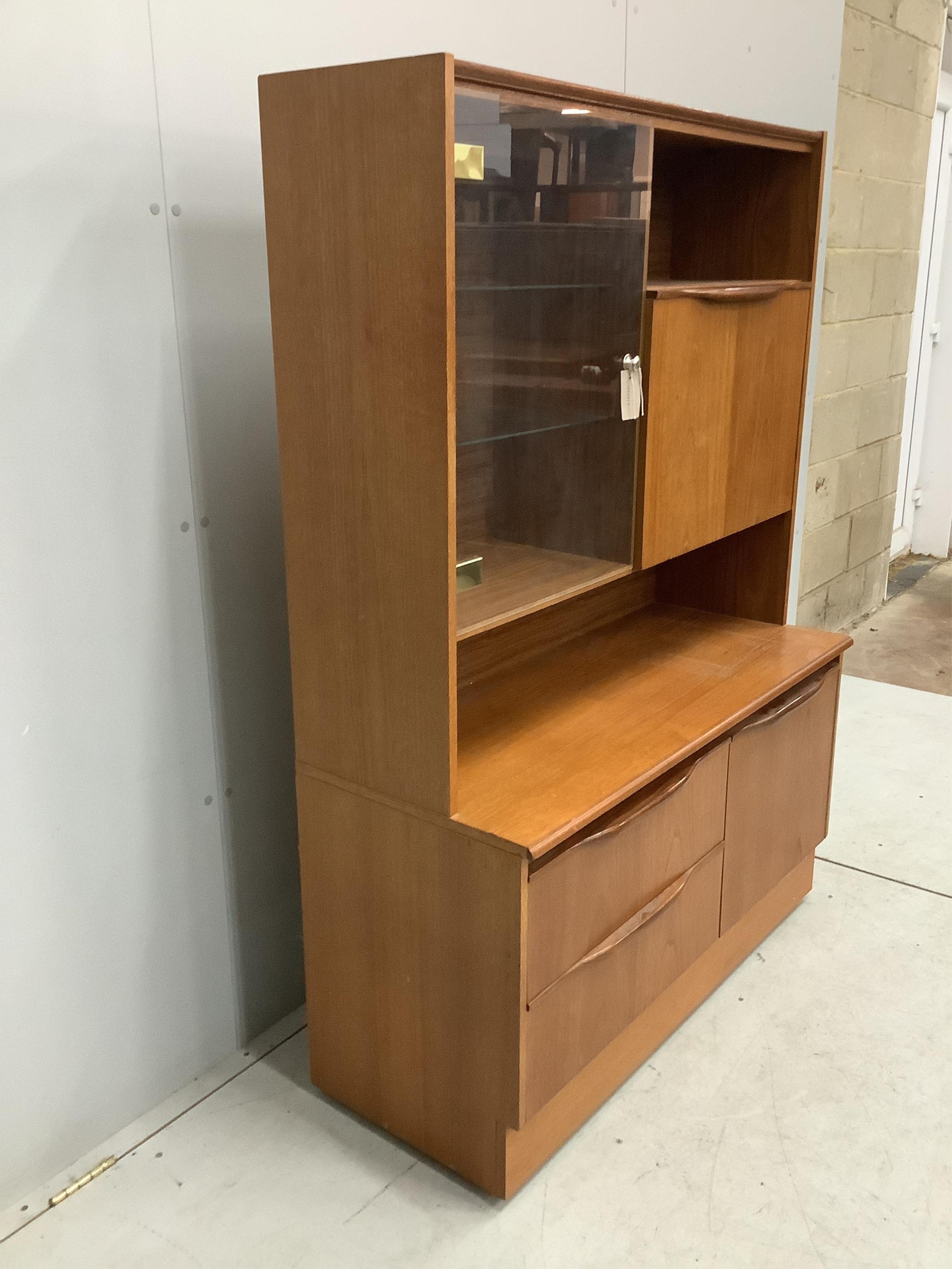 A G plan display unit, width 106cm, depth 43cm, height 149cm. Condition - fair to good